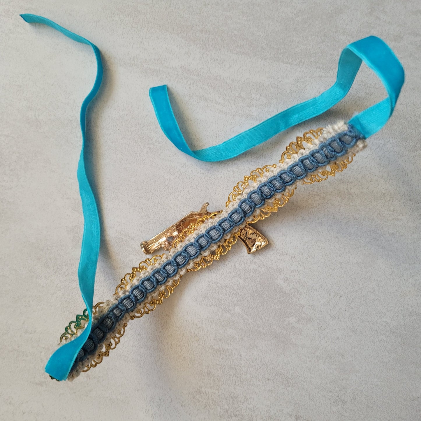 WhatEver collection: The Count Your Blessings metal choker with a turquoise blue revolver and faux irredecent pearls