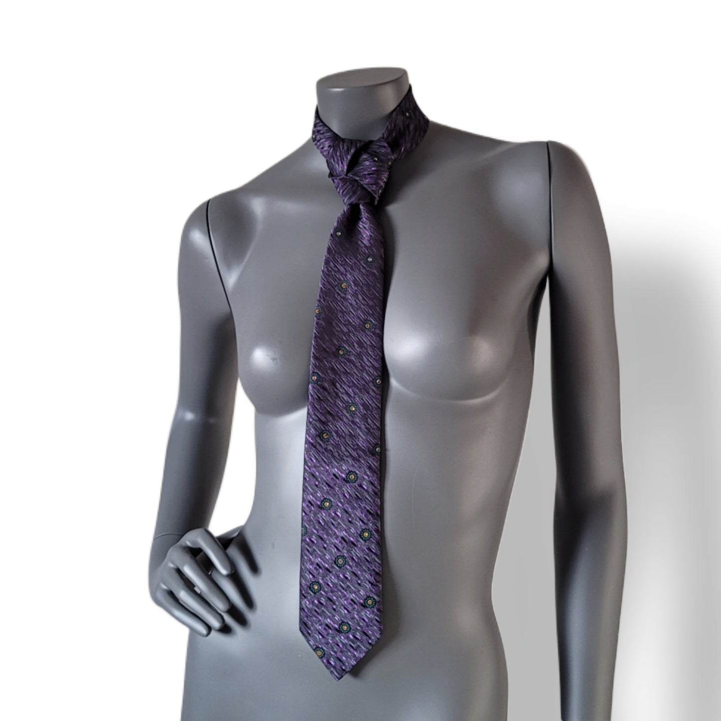 Another Dance collection: Riders on the Storm tie, vintage polyester necktie diagonally striped in purple and black with small green flowers adorned with shimmering mine gold glass crystals