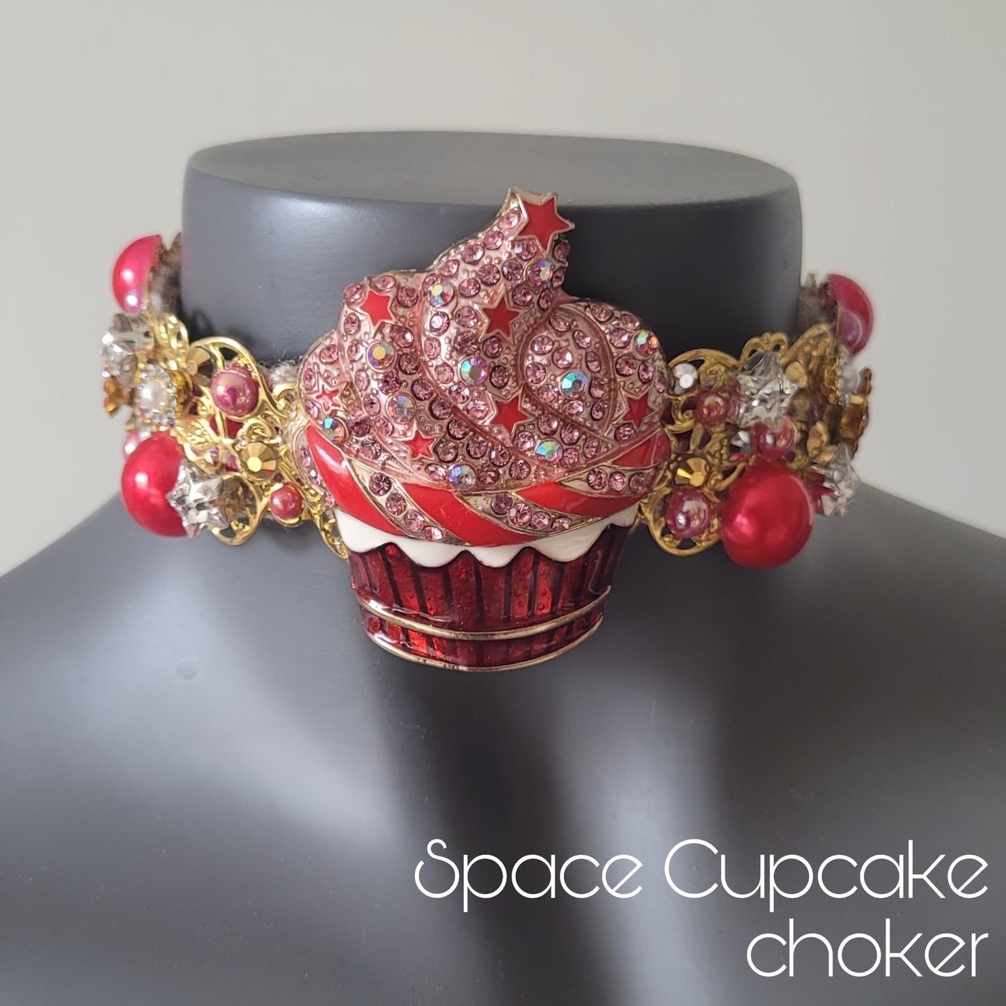WhatEver collection: The Space Cupcake metal choker with a cupcake with star sprinkled glaze, star shaped glass crystals, rhinestones, and and faux red pearls