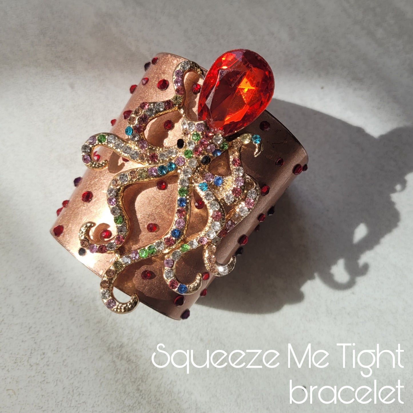 WhatEver collection: The Squeeze Me Tight copper bracelet, adorned with sparkling glass crystals in red and purple, and a crystal encrusted octopus. From the 2018's OG WhatEver collection ❤️🔥