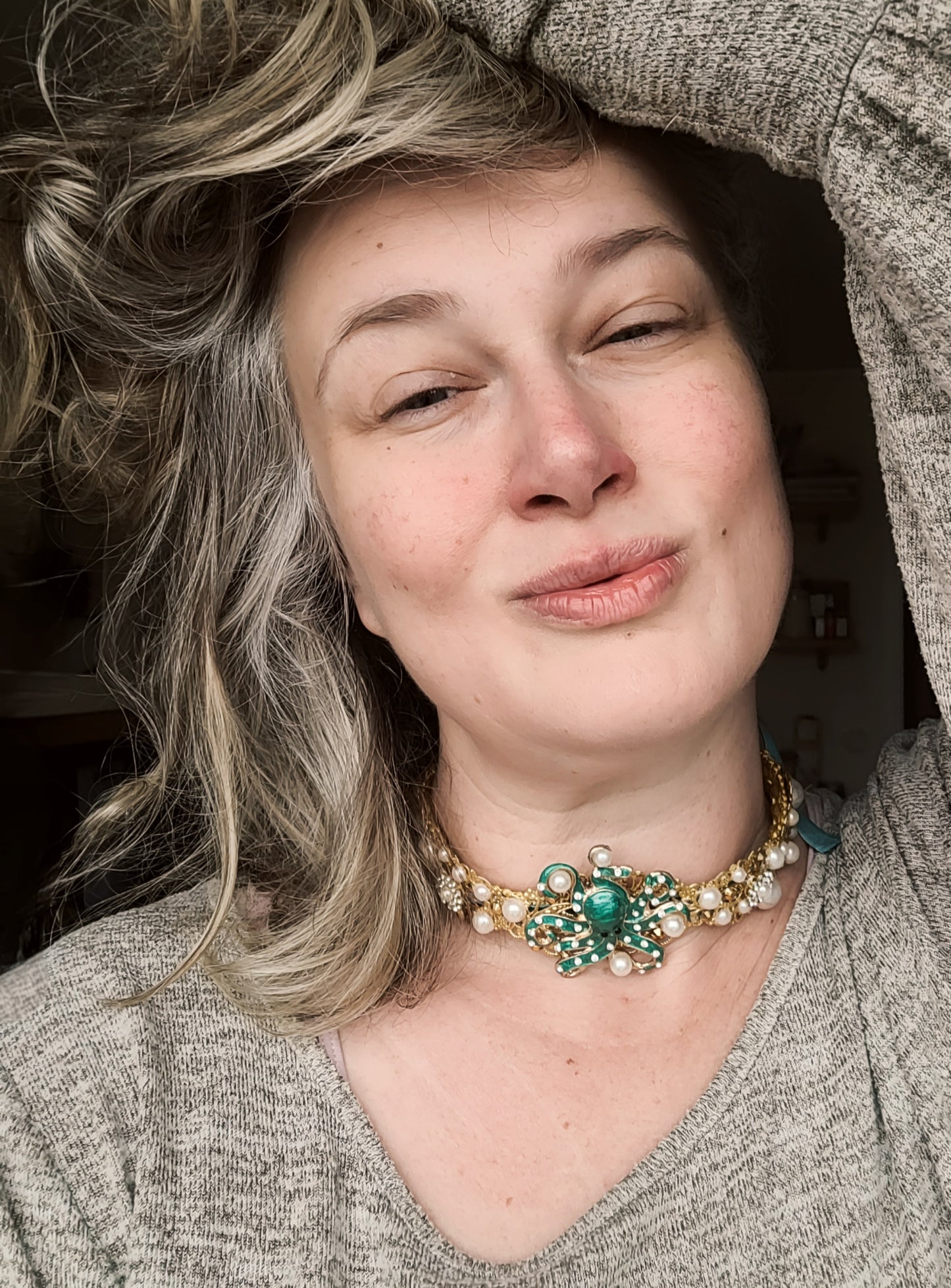 WhatEver collection: Underwater Catch metal choker with a green octapus throwing around faux pearls surrounded by pearls and shimmering glass crystals