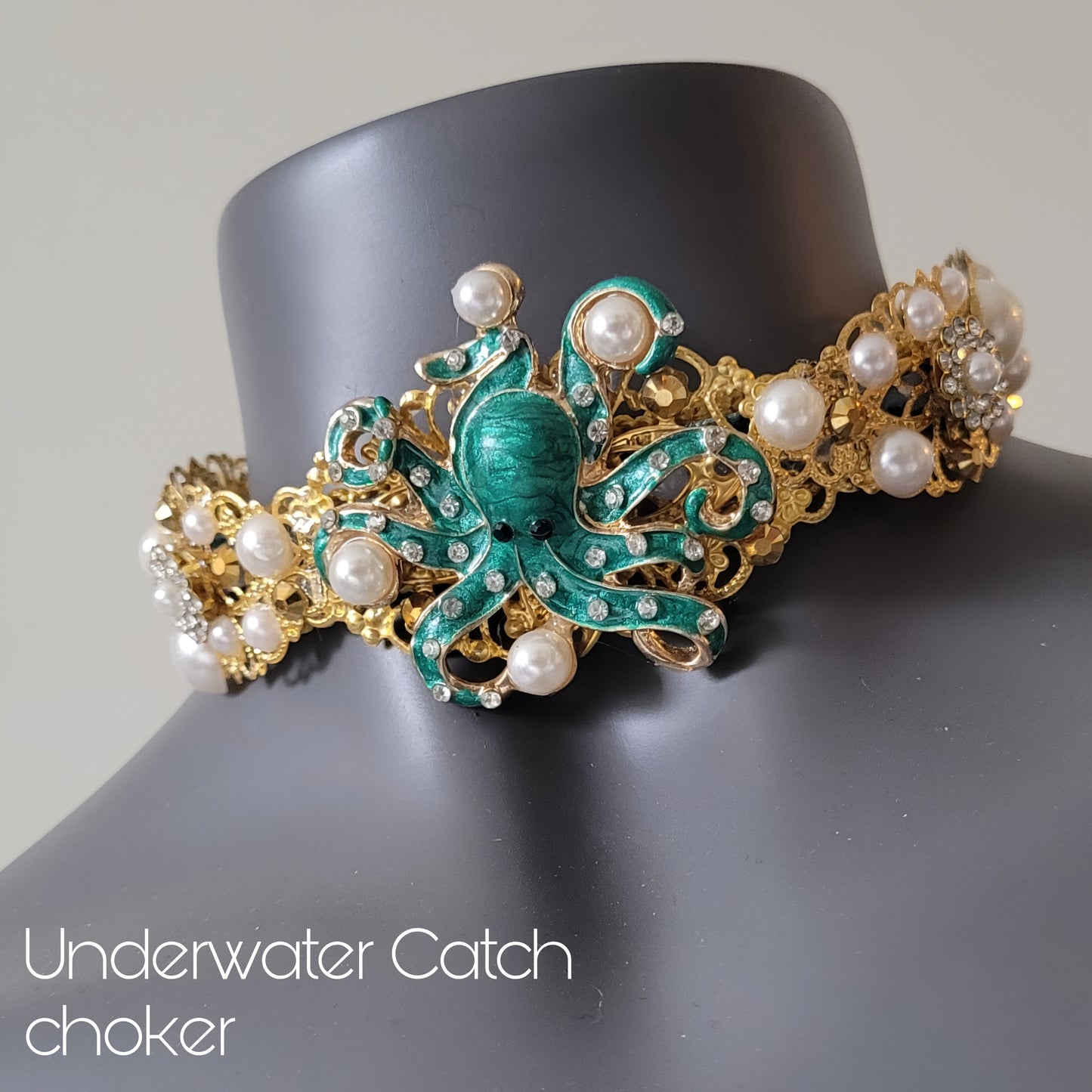 WhatEver collection: Underwater Catch metal choker with a green octapus throwing around faux pearls surrounded by pearls and shimmering glass crystals