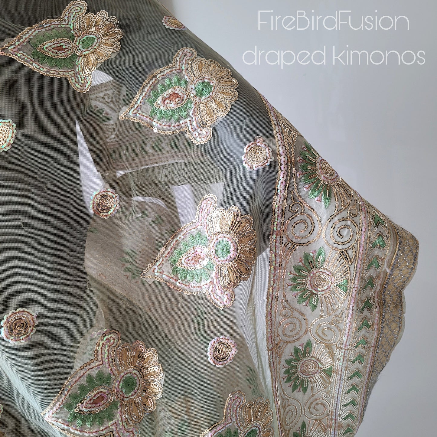 Draped short kimono in light yellow & ivory synthetic net fabric with beautiful embrodery and broad trims (M)