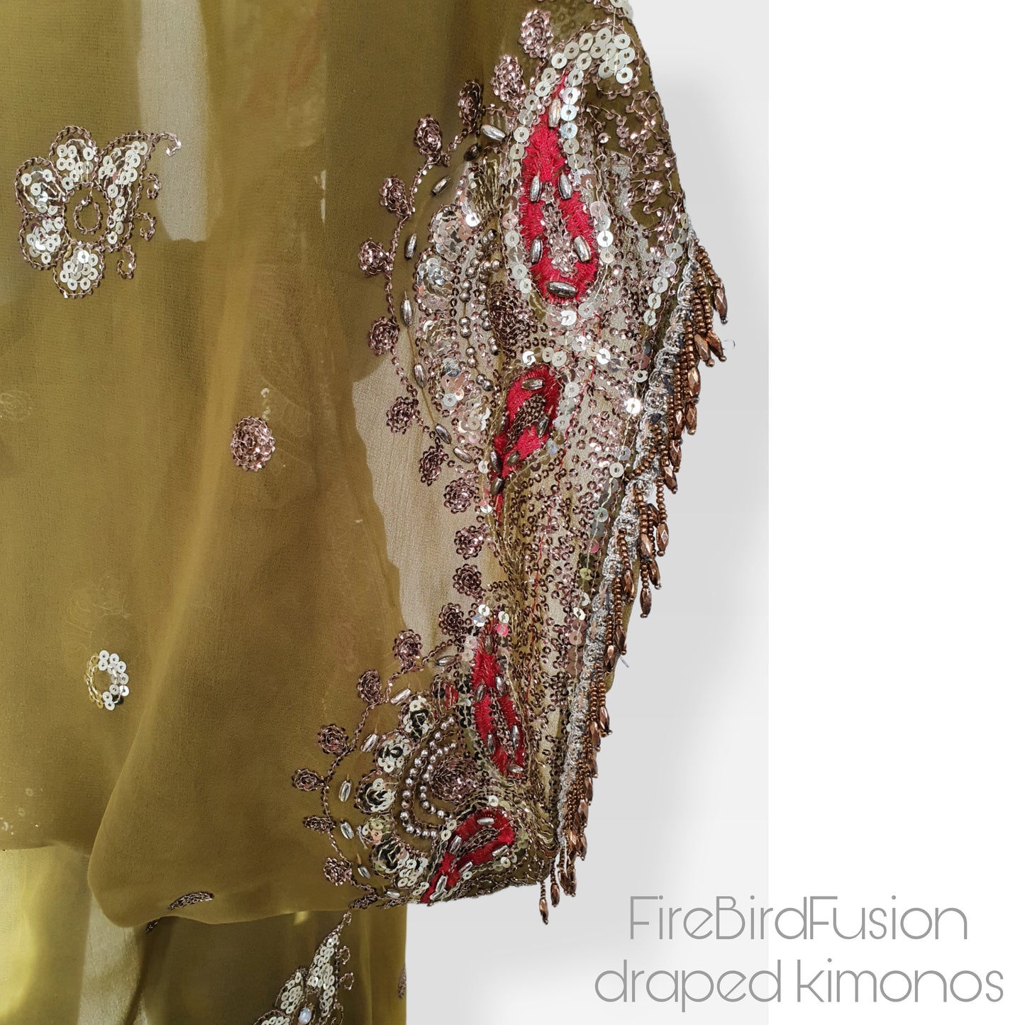 Draped kimono in light olive green with broad embroidered trim in gold, silver and red and beaded fringe (M)