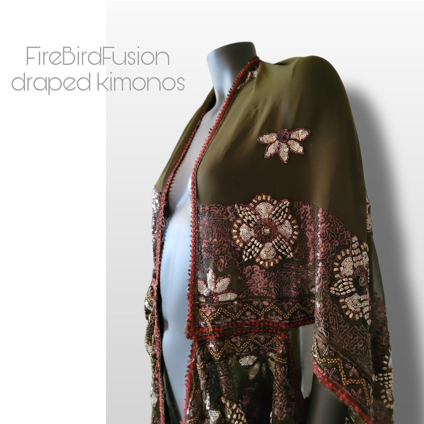 Draped kimono in light olive green with golden shine and broad embroidered trim in wine red, silver and bronze (M-L)