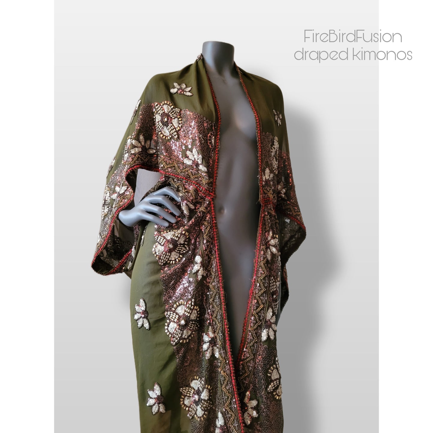 Draped kimono in light olive green with golden shine and broad embroidered trim in wine red, silver and bronze (M-L)