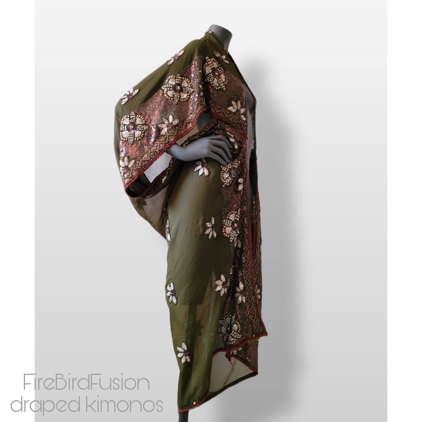 Draped kimono in light olive green with golden shine and broad embroidered trim in wine red, silver and bronze (M-L)