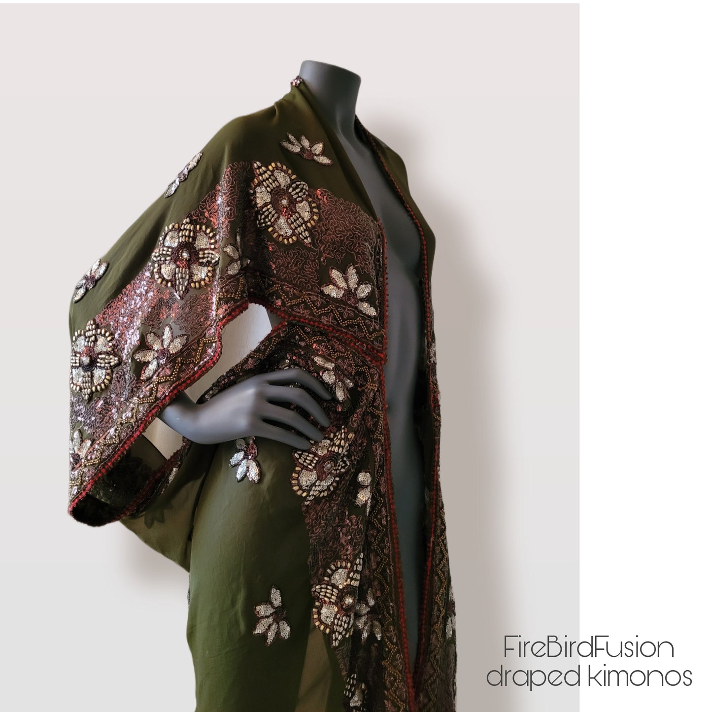 Draped kimono in light olive green with golden shine and broad embroidered trim in wine red, silver and bronze (M-L)