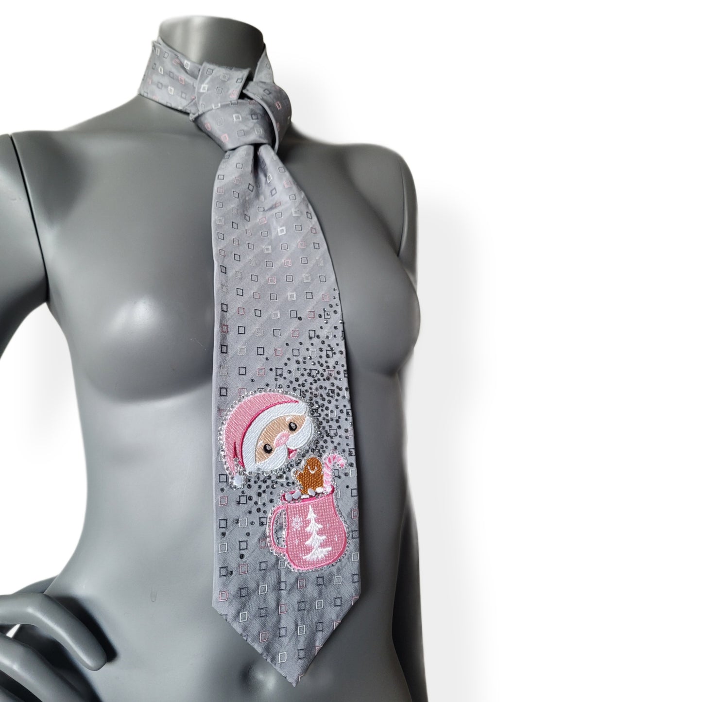 Another Dance collection, Christmas 2025 edition: A Marshmallow World tie, vintage silk necktie with small square pattern in gray, pink, and white with Santa enjoying a cup of hot chocolate surrounded by shimmering black diamond glass crystals