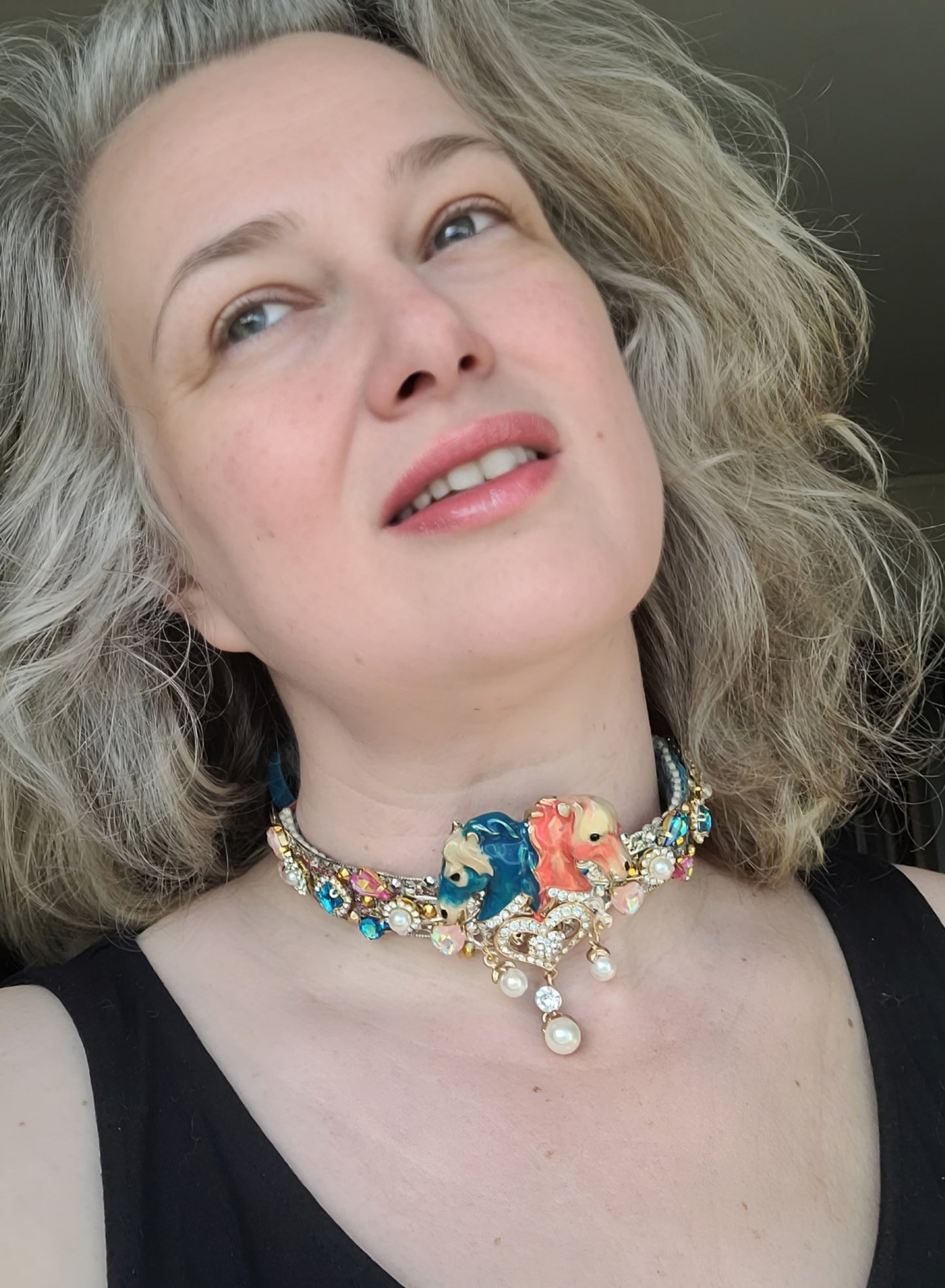 WhatEver collection: The All The Pretty Little Horses metal choker with two horse heads (pink and blue), dangling pearls, high quality glass crystals, rhinestones, and two coloured velvet ribbons