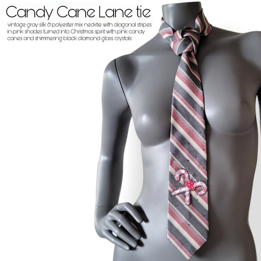 Another Dance collection, Christmas 2025 edition: Candy Cane Lane tie, vintage gray silk & polyester mix necktie with diagonal stripes in pink shades turned into Christmas spirit with pink candy canes and shimmering black diamond glass crystals