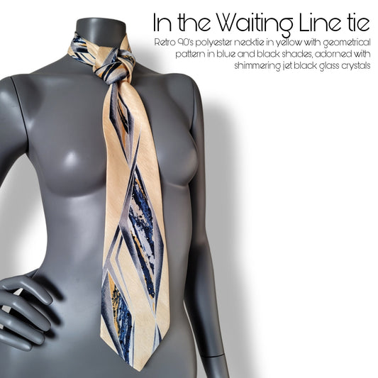 Another Dance collection: In the Waiting Line tie, retro 90's yellow polyester necktie with geometrical pattern in black, blue, and yellow adorned with jet black glass crystals