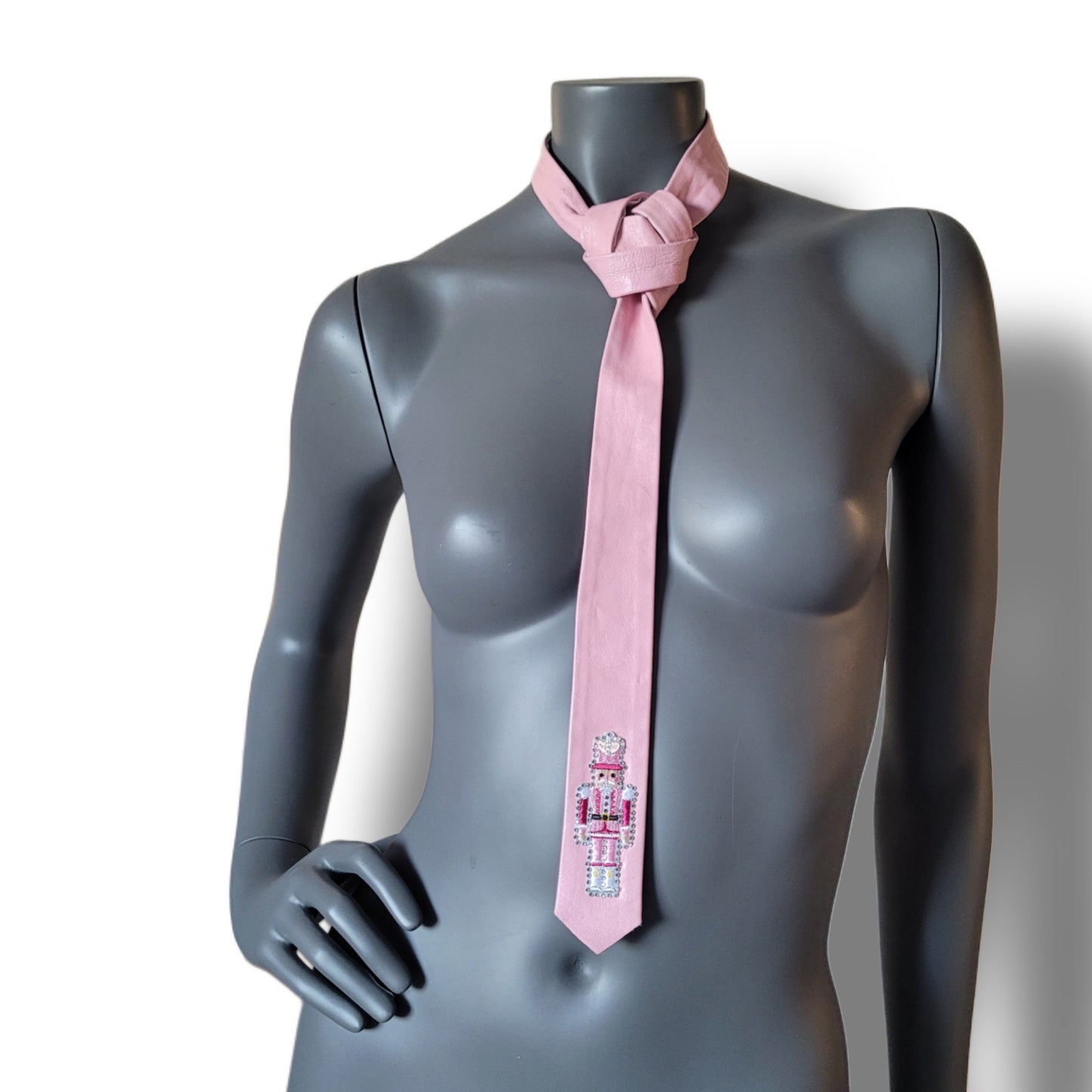 Another Dance collection, Christmas 2025 edition: Last Christmas tie, vintage slim pink necktie in German leather with a lonely nutcracker surrounded by shimmering icy cold glass crystals