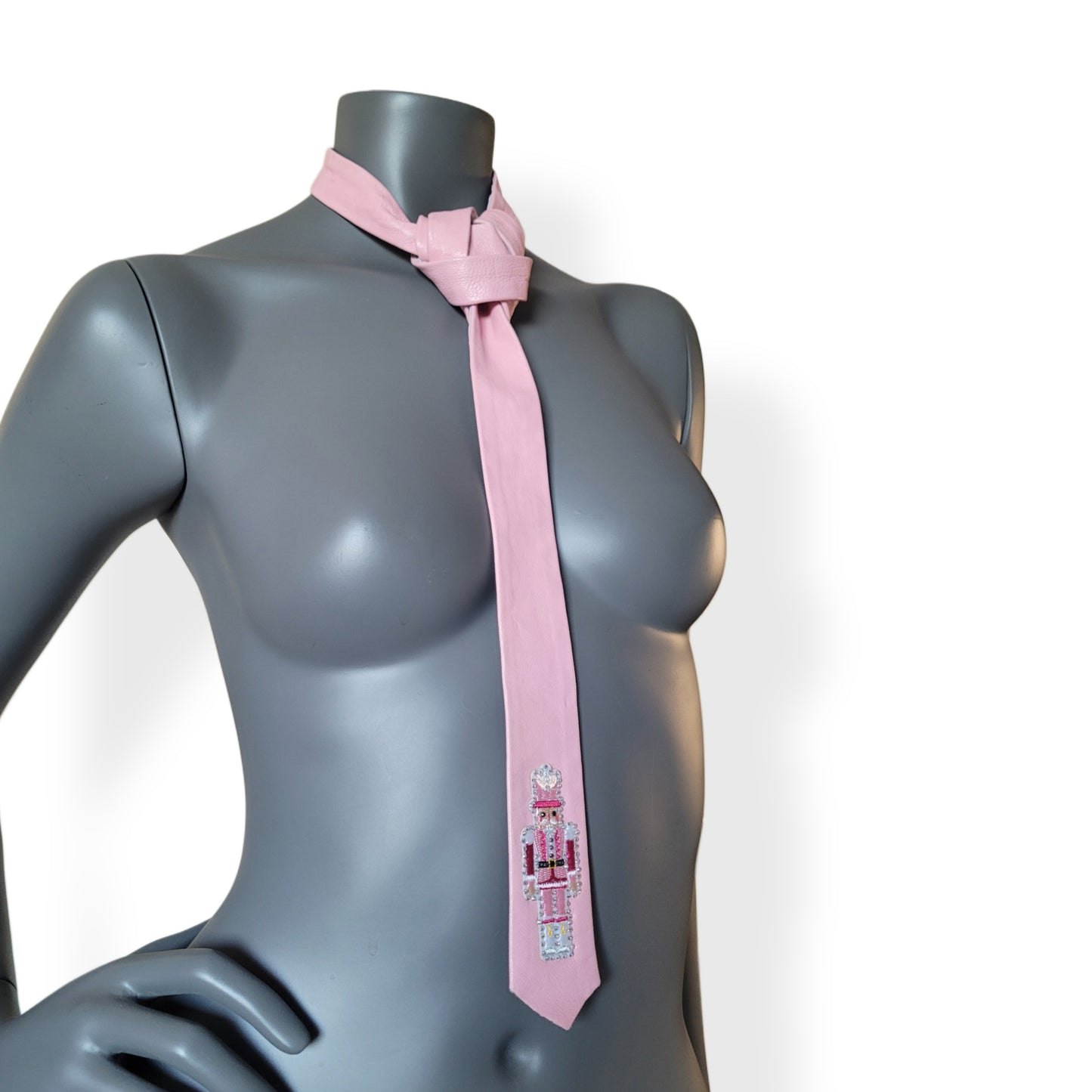 Another Dance collection, Christmas 2025 edition: Last Christmas tie, vintage slim pink necktie in German leather with a lonely nutcracker surrounded by shimmering icy cold glass crystals