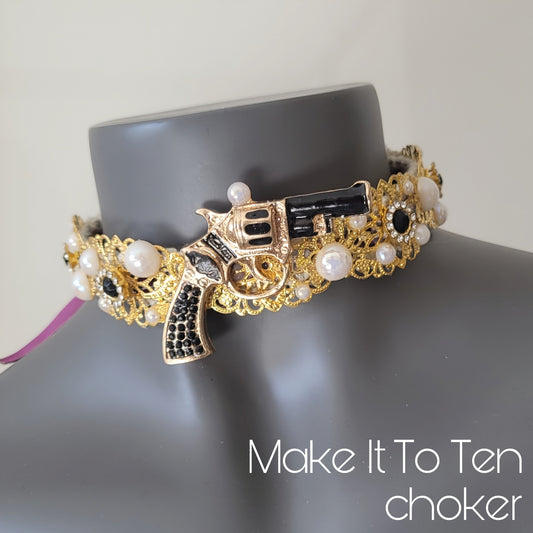 WhatEver collection: The Make It To Ten metal choker with a black revolver, glass crystals and faux irredecent pearls