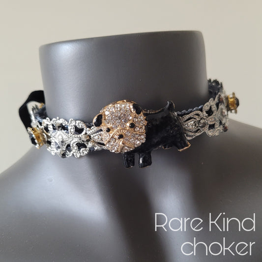 WhatEver collection: Rare Kind metal choker with a black and white French bulldog surrounded by shimmering glass crystals and rhinestones
