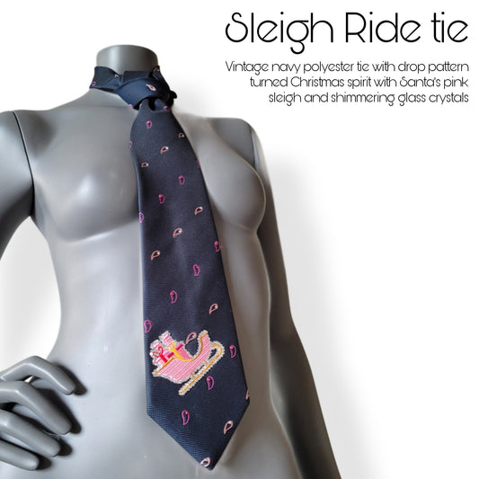 Another Dance collection, Christmas 2025 edition: Sleigh Ride tie, vintage navy polyester necktie with drop pattern in pink shades turned into Christmas spirit with Santa's pink sleigh and shimmering glass crystals