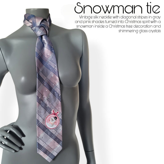 Another Dance collection, Christmas 2025 edition: Snowman tie, vintage silk necktie with diagonal stripes in gray and pink shades turned into Christmas spirit with a snowman inside a Christmas tree decoration and shimmering glass crystals