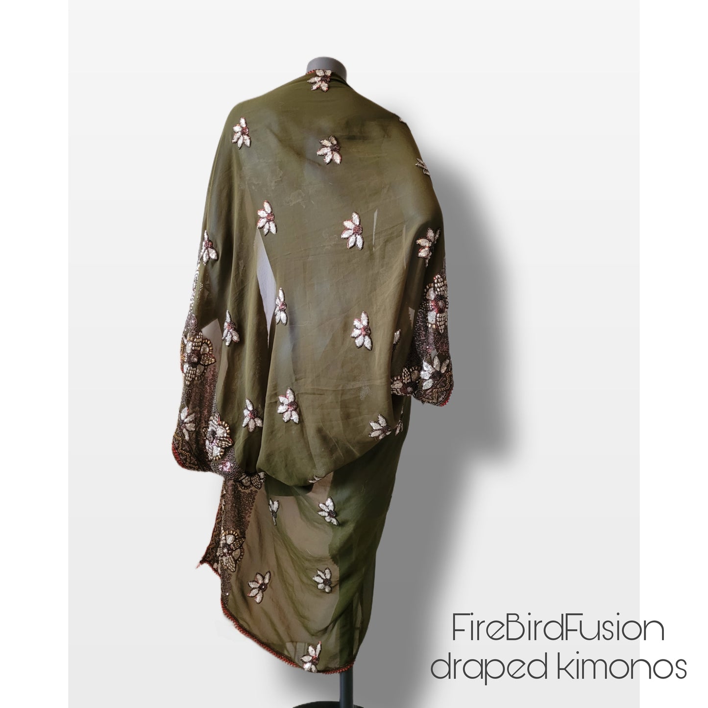 Draped kimono in light olive green with golden shine and broad embroidered trim in wine red, silver and bronze (M-L)