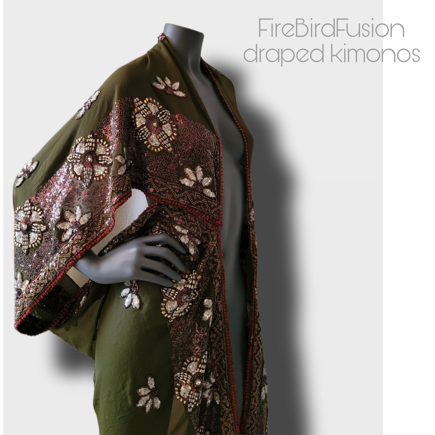 Draped kimono in light olive green with golden shine and broad embroidered trim in wine red, silver and bronze (M-L)